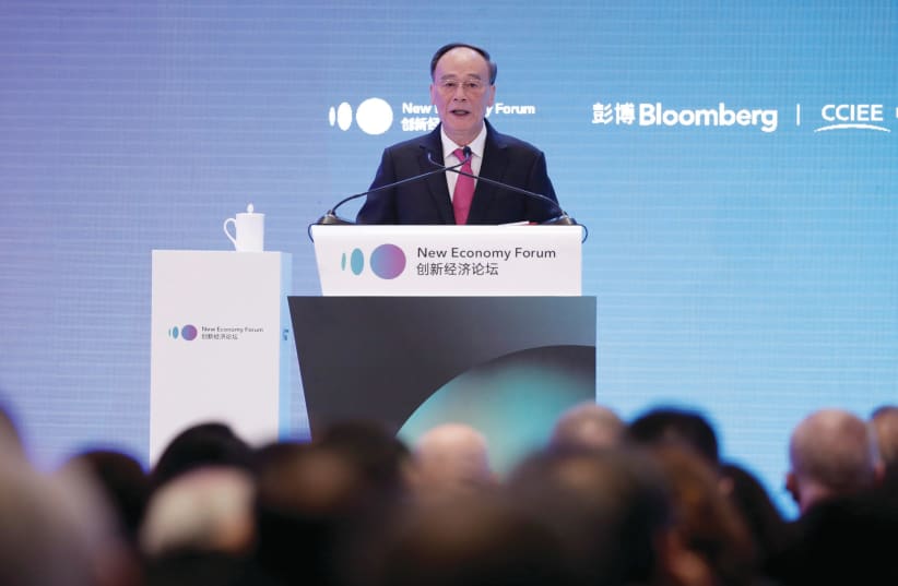 CHINESE VICE-PRESIDENT Wang Qishan speaks at the 2019 New Economy Forum in Beijing. (photo credit: REUTERS)