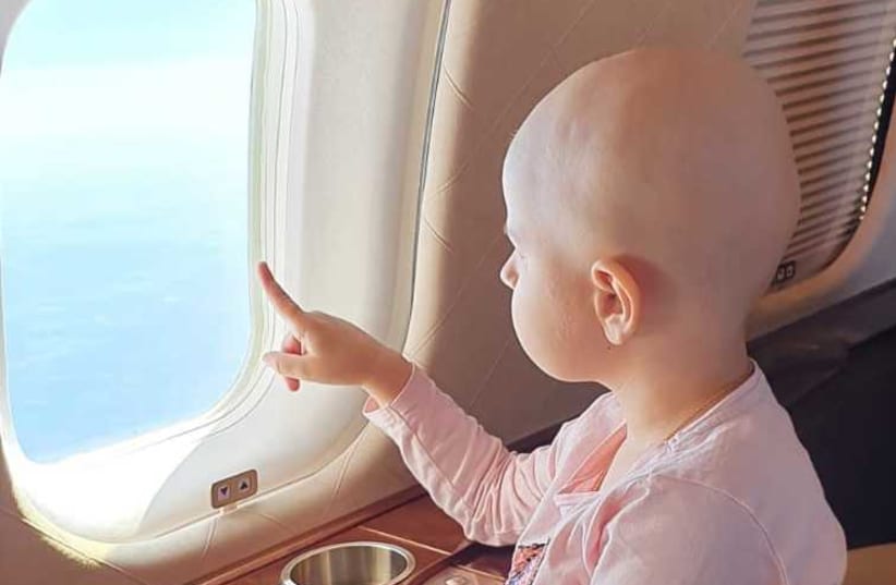 Four-year old Sabin while on a private flight to receive innovative cancer treatment in New York.  (photo credit: ISRAEL KASEM)