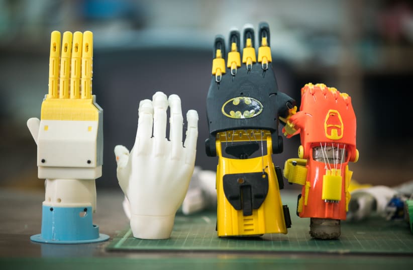 3D printed mechanical and robotic prosthetic hands (photo credit: NITZAN ZOHAR/TECHNION SPOKESPERSON'S OFFICE)