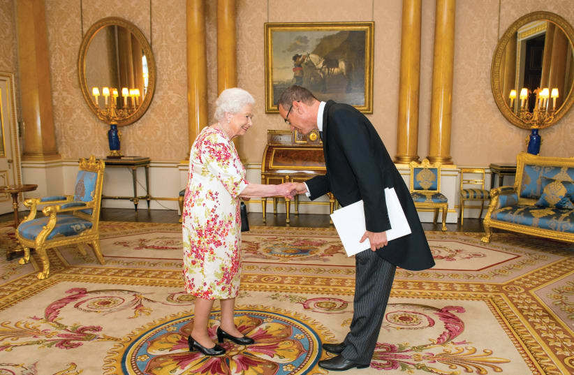 Ambassador Mark Regev meets Queen Elizabeth during a private audience at Buckingham Palace in 2016 (photo credit: DOMINIC LIPINSKI / POOL / REUTERS)
