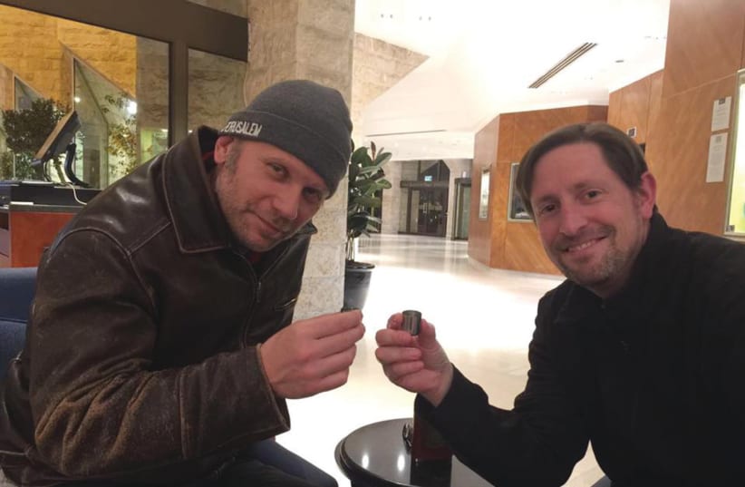 CELEBRITIES CONNECTED with Israellycool help boost the blog’s social media profile. Here actor Mark Pellegrino, left, raises a glass with David Lange at a 2017 celebrity event in Jerusalem called “America’s Voices in Israel.”  (photo credit: ISRAELLYCOOL)