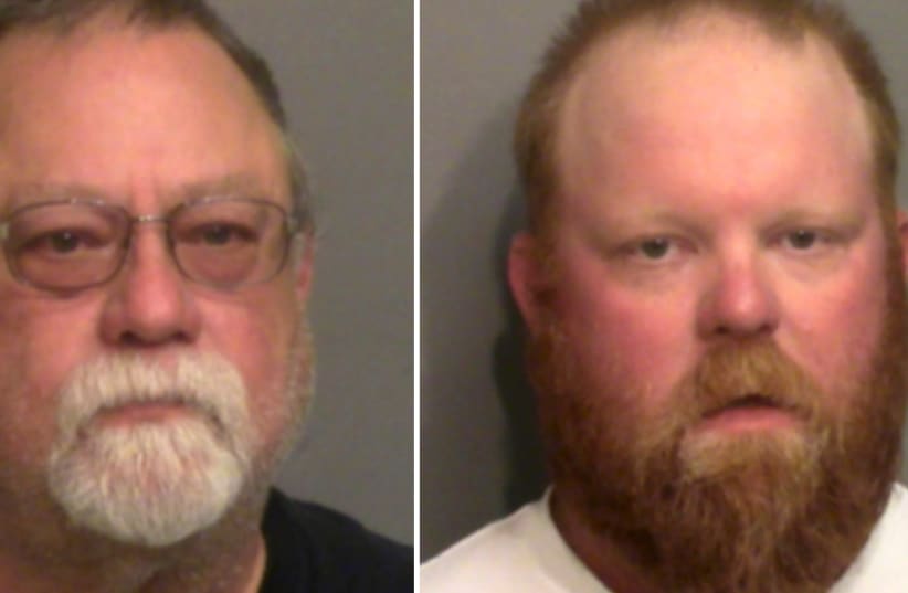 Former police officer Gregory McMichael, 64, and his son Travis McMichael pose for a booking photo they were arrested by the Georgia Bureau of Investigation and charged with murder in the shooting death of unarmed black man Ahmaud Arbery, in Brunswick, Georgia, U.S. in a combination of photographs t (photo credit: GLYNN COUNTY SHERIFF'S OFFICE/HANDOUT VIA REUTERS.)