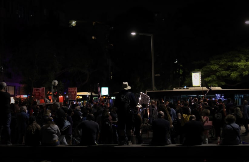 Protesters blocking the road at a protest against the expansion of police authority in Tel Aviv (photo credit: LEON SVERDLOV)