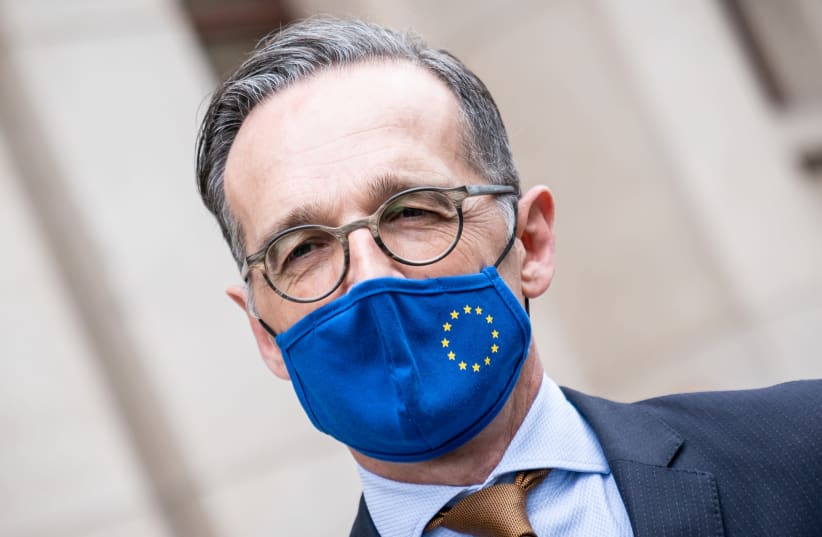 erman Foreign Minister Heiko Maas wears a face mask next to his Italian counterpart Luigi Di Maio (not pictured) after a meeting to discuss the coronavirus disease (COVID-19) outbreak, in Berlin, Germany, June 5, 2020 (photo credit: MICHAEL KAPPELER/POOL VIA REUTERS)