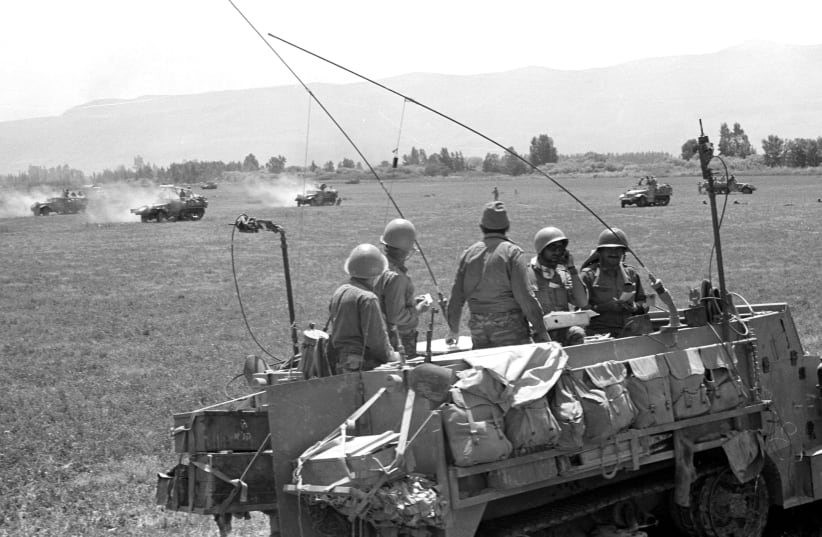 SOLDIERS IN an armored vehicle on the Syrian front line in 1967.  (photo credit: REUTERS)