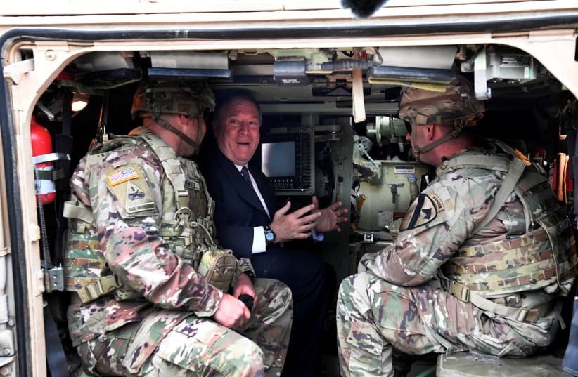 U.S. Secretary of State Mike Pompeo sits in a tank as he talks to U.S. soldiers based in Grafenwoehr, Germany November 7, 2019 (photo credit: REUTERS)