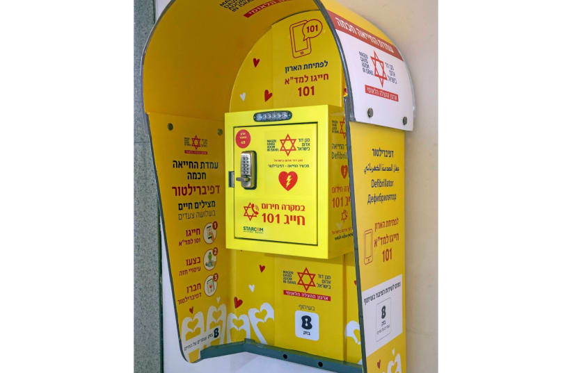 A public phone booth which has been converted into a defibrillator station as part of a plan to replace thousands of phone booths by Bezeq Israel Telecom and the country's ambulance service, is seen in Tel Aviv, Israel June 8, 2020 (photo credit: RONEN TOPELBERG/BEZEQ ISRAEL TELECOM/HANDOUT VIA REUTERS)