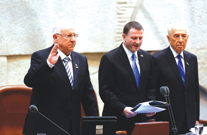 REUVEN RIVLIN is sworn in as Israel’s 10th president on July 24, 2014, alongside then-Knesset speaker Yuli Edelstein and outgoing president Shimon Peres. (photo credit: YONATAN SINDEL/FLASH 90)