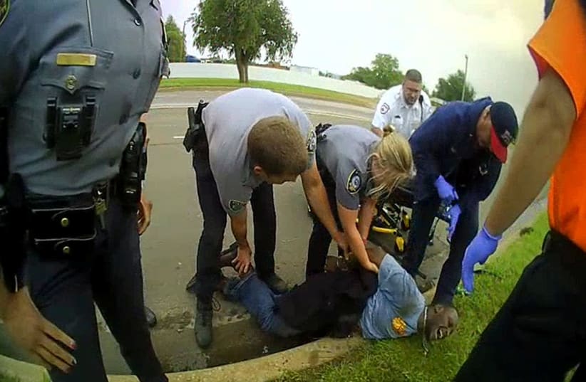 Police detain Derrick Scott in Oklahoma City, Oklahoma, U.S., May 20, 2019 in this framegrab from police body cam footage released on June 10, 2020. (photo credit: OKLAHOMA CITY POLICE DEPARTMENT/HANDOUT VIA REUTERS)