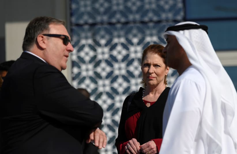 US Secretary of State Mike Pompeo and his wife Susan speak with the Emirati Ambassador to the US Yousef Al Otaiba at the NYU Abu Dhabi, United Arab Emirates January 13, 2019 (photo credit: ANDREW CABALLERO-REYNOLDS/REUTERS)