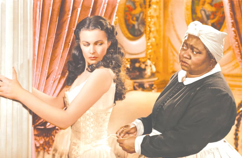 Hattie McDaniel (R) and Vivien Leigh (L) in the iconic roles of Mammy and Scarlett O'Hara in the 1939 film 'Gone with the Wind.' Her role earned McDaniel the Academy Award for Best Supporting Actress, she was the first African-American actor to win an Oscar.   (photo credit: Courtesy)