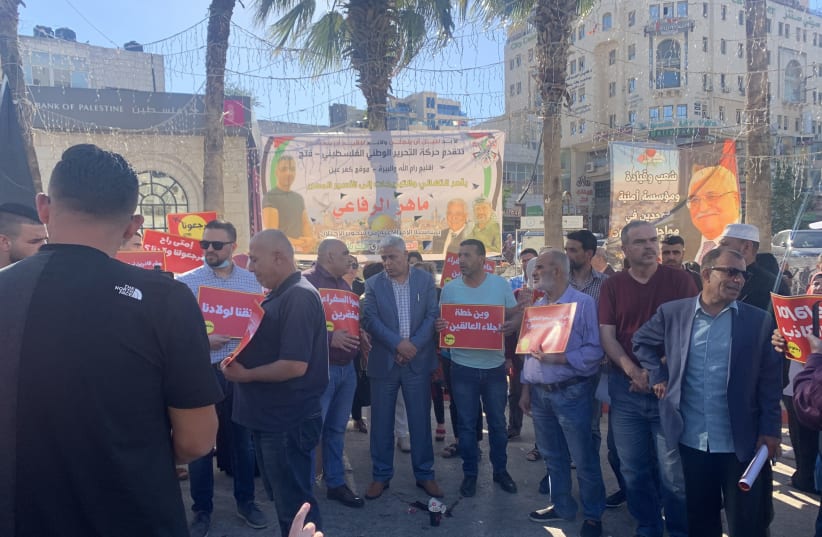 Palestinian parents demonstrating in Ramallah, on the West Bank, as part of the “Return Us to Our Homes” campaign, June 15, 2020. (photo credit: DIMA ABUMARIA/TML PHOTOS)