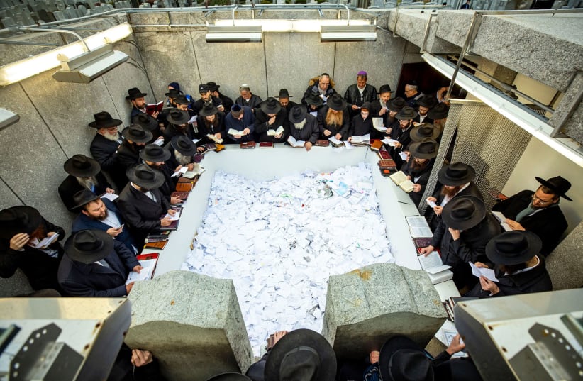 CHABAD RABBIS pay their respects at the Rebbe’s resting place in November 2019. (photo credit: MENDEL GROSSBAUM/CHABAD.ORG)