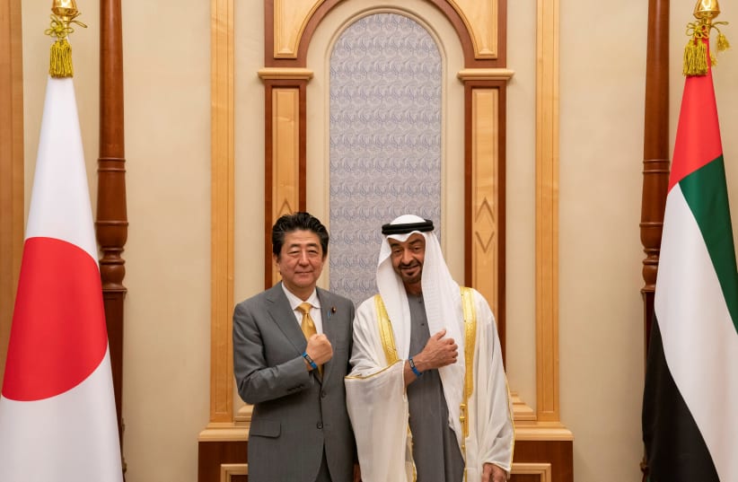 ABU DHABI’S Crown Prince Sheikh Mohammed bin Zayed al-Nahyan gestures with Japanese Prime Minister Shinzo Abe during a meeting in United Arab Emirates. (photo credit: REUTERS)