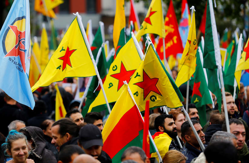 Pro-Kurdish demonstrators protest against Turkey's military action in northeastern Syria in Cologne, Germany, October 19, 2019 (photo credit: THILO SCHMUELGEN/REUTERS)
