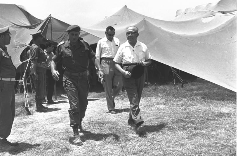 PRIME MINISTER Levi Eshkol (right), accompanied by OC Southern Command Yeshayahu Gavish, visit troops in the South during the Six Day War. (photo credit: Wikimedia Commons)