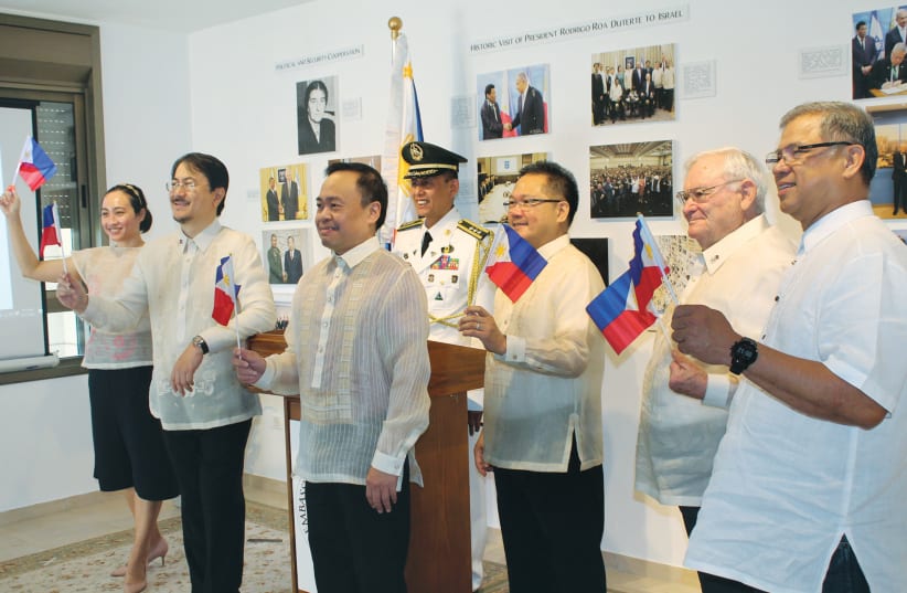 RAISING THE flag ceremony on Philippines Independence Day. (photo credit: COURTESY PHILIPPINES EMBASSY)
