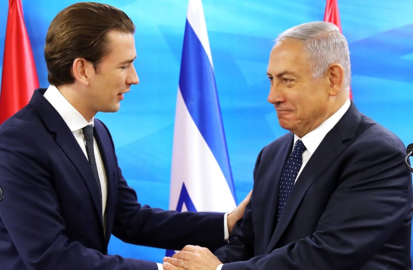 Austrian Chancellor Sebastian Kurz, left, with Israeli Prime Minister Benjamin Netanyahu at a joint news conference in Jerusalem, June 11, 2018 (photo credit: AMMAR AWAD/AFP VIA GETTY IMAGES/JTA)