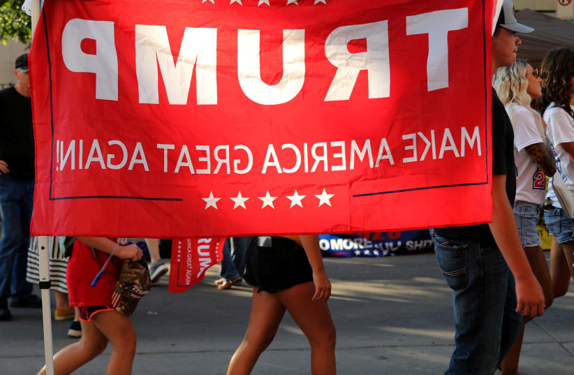 Supporters of U.S. President Donald Trump walk outside the venue for Trump's rally in Tulsa, Oklahoma, U.S., June 20, 2020 (photo credit: REUTERS/GORAN TOMASEVIC/FILE PHOTO)