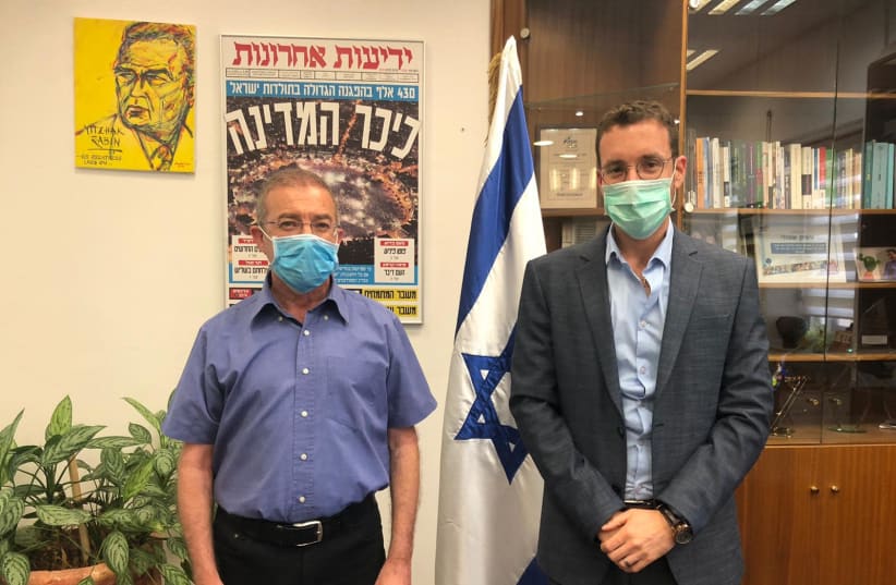 National Insurance Institute director-general Meir Spiegler (left) and Labor and Welfare Minister Itzik Shmuli  (photo credit: LABOR AND SOCIAL SERVICES MINISTRY)