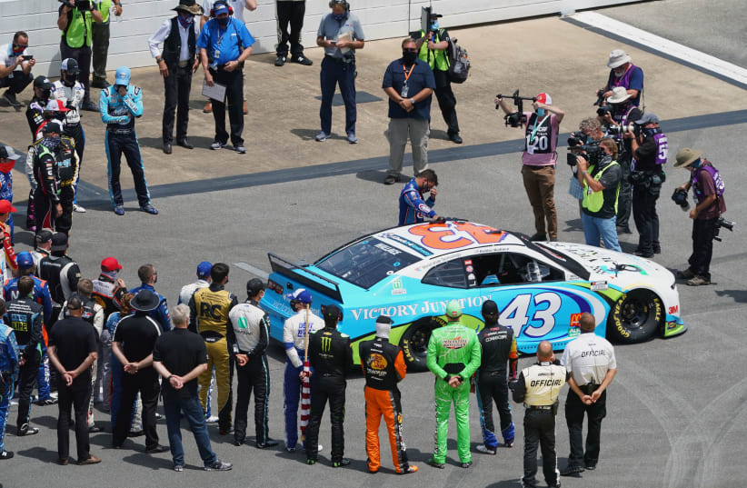 NASCAR Cup Series driver Bubba Wallace (43) pauses before climbing in to his car before the Geico 500 at Talladega Superspeedway. (photo credit: JOHN DAVID MERCER/USA TODAY SPORTS)