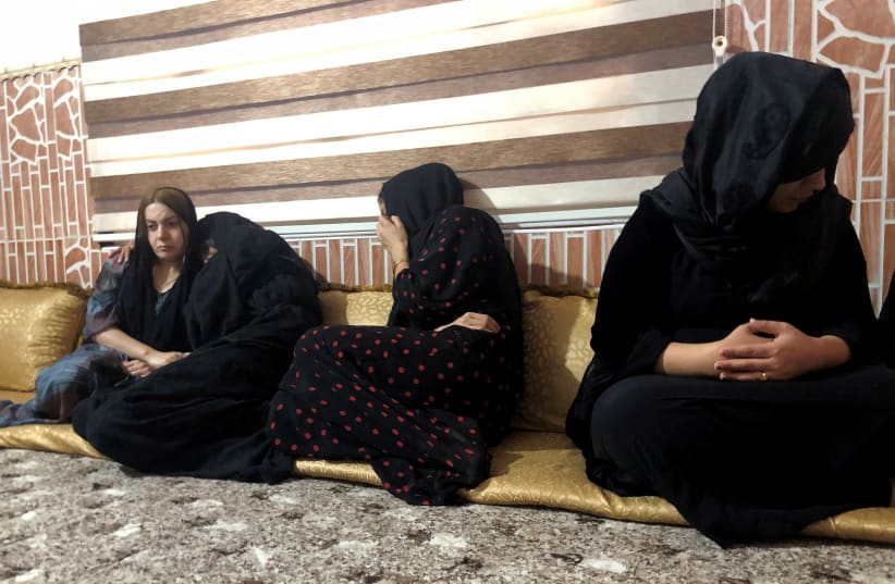 Women mourn the death of a man who was killed in a Turkish airstrikes in Sheladize in the north of Dohuk province, close to the Turkish border, Iraq June 22, 2020. (photo credit: REUTERS/KAWA OMAR)