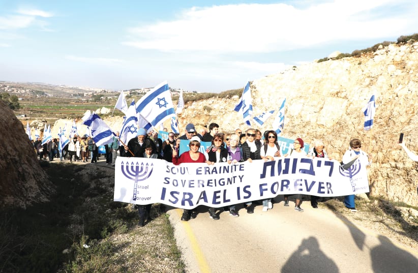ISRAEL’S RIGHT to assert sovereignty over the heart of the homeland of the Jewish people is grounded in international law, historical evidence and present reality. Pictured: A February demonstration march demanding Israeli sovereignty in the West Bank. (photo credit: GERSHON ELINSON/FLASH90)