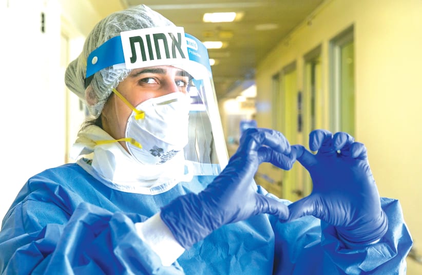 A MEDICAL worker at the coronavirus unit, in Tel Aviv Sourasky Medical Center (Ichilov) hospital last month. (photo credit: YOSSI ALONI/FLASH90)