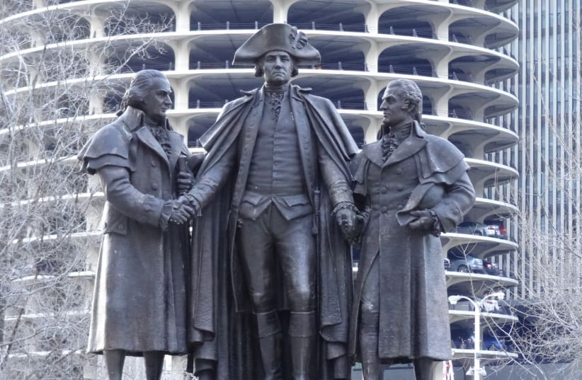 IN THIS memorial along the Chicago River, George Washington, in his Revolutionary War uniform, shakes hands with English-born Robert Morris on his right and Polish-Jewish emigrant Salomon on his left. Morris, a signer of the Declaration of Independence, and Salomon provided financial support to assu (photo credit: FLICKR)