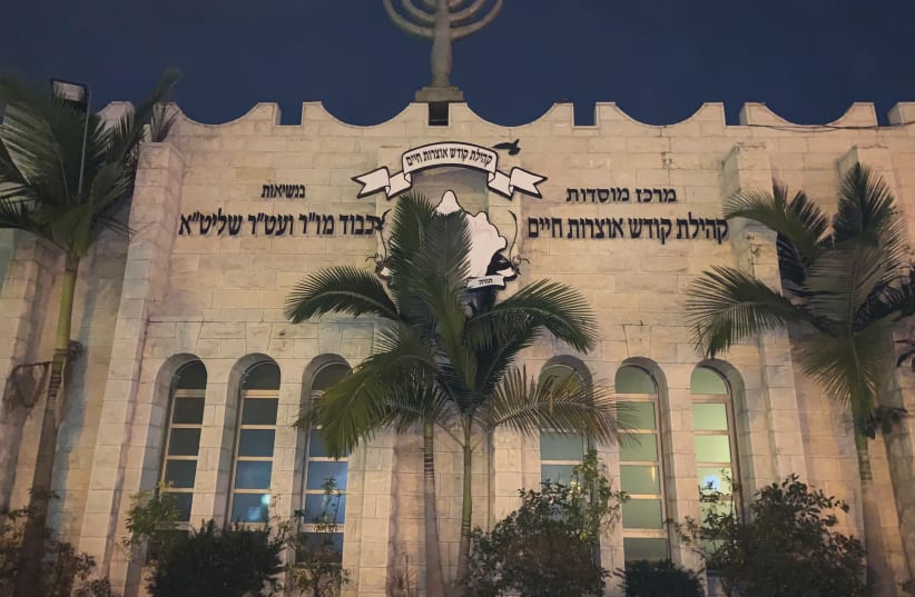 THE GLOWING Yismach Moshe Synagogue at night, a major religious center of Ashdod’s Moroccan Jewry. (photo credit: JACOB SOLOMON)