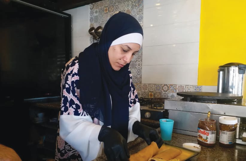 SABRIN SNOUNU, chef/owner of Snounu restaurant in central Gaza, creates some good-looking crepes. (photo credit: HAZEM ALBAZ)