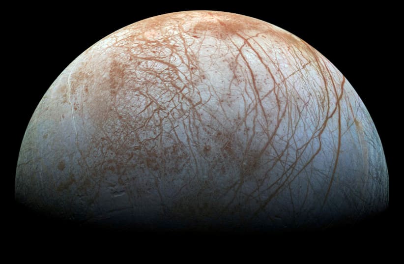 A view of Jupiter's moon Europa created from images taken by NASA's Galileo spacecraft in the late 1990's, according to NASA, obtained by Reuters May 14, 2018. (photo credit: REUTERS)