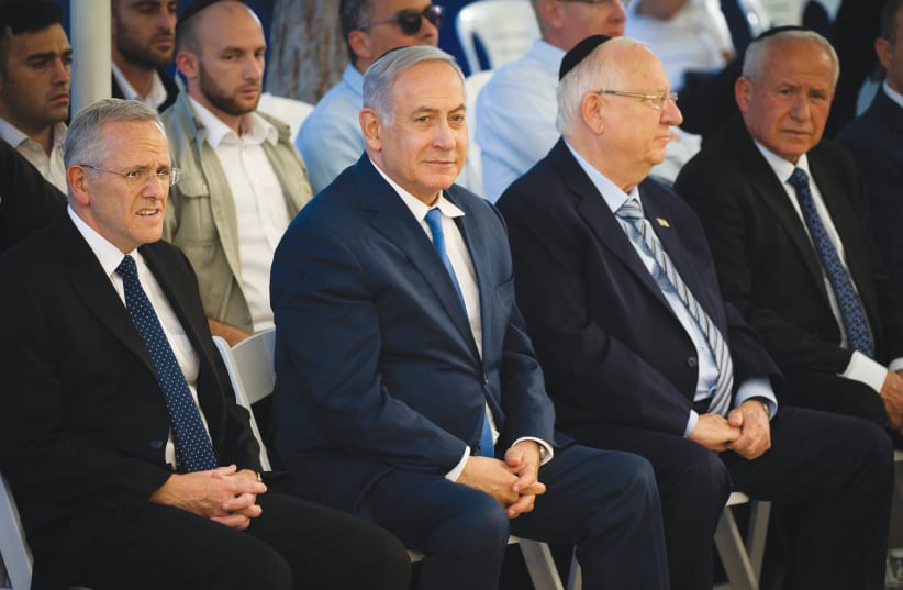 PRIME MINISTER Benjamin Netanyahu and President Reuven Rivlin attend a memorial ceremony for Ze’ev Jabotinsky at Mount Herzl in Jerusalem last year. (photo credit: FLASH90)