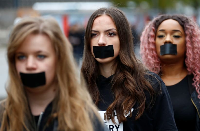 Activists take part in a 'Walk for Freedom' to protest against human trafficking in Berlin, Germany, October 20, 2018 (photo credit: REUTERS/FABRIZIO BENSCH)