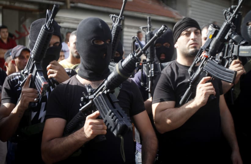 Palestinian militants of Fatah's al-Aqsa Martyrs Brigades take part in a military show as they protest against Israel's plan to annex parts of the West Bank, in Nablus June 07, 2020 (photo credit: NASSER ISHTAYEH/FLASH90)