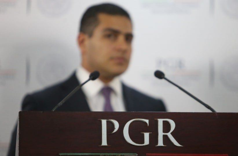 A PGR logo is pictured on a lectern during a news conference of Omar Hamid Garcia Harfuch, Director in chief of the Federal Bureau of Investigation of the Attorney General's Office (PGR) in Mexico City, Mexico, April 1, 2017 (photo credit: REUTERS)