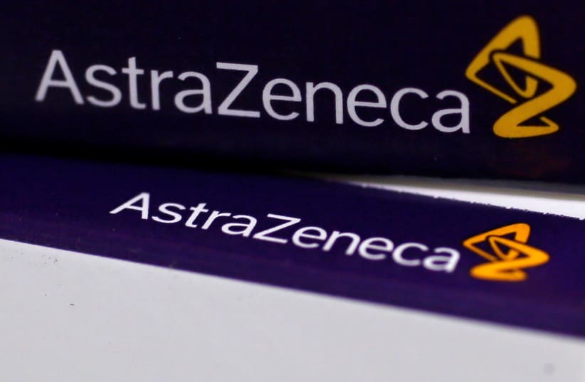 The logo of AstraZeneca is seen on medication packages in a pharmacy in London (photo credit: REUTERS)