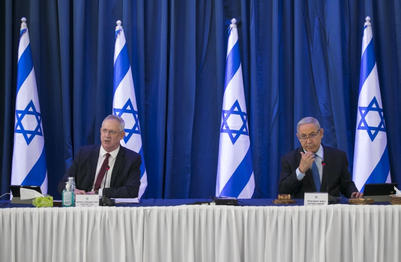 Alternate Prime Minister Benny Gantz (L) sits alongside Prime Minister Benjamin Netanyahu at the weekly cabinet meeting, June 28, 2020 (photo credit: OLIVIER FITOUSSI/FLASH90)