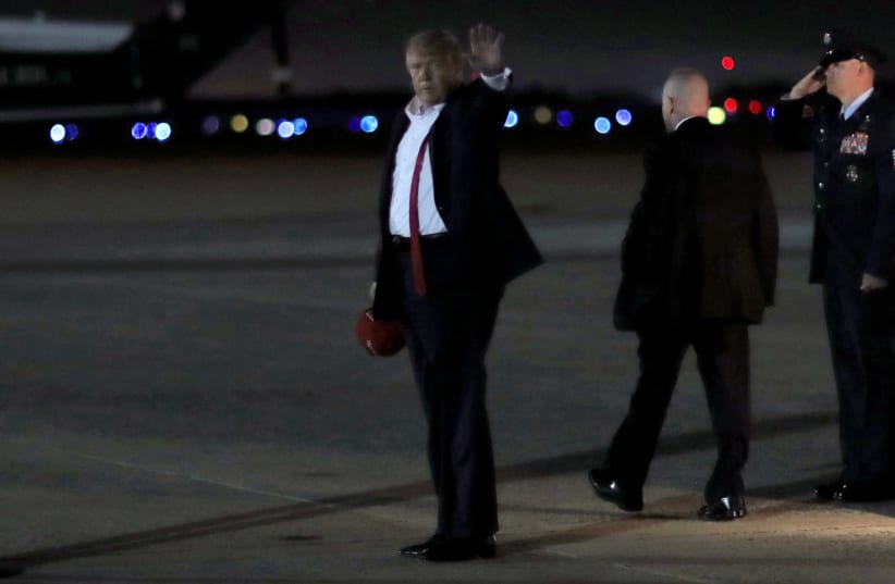 U.S. President Donald Trump deplanes Air Force One on his way back to the White House after holding a campaign rally in Tulsa (photo credit: LEAH MILLIS/REUTERS)
