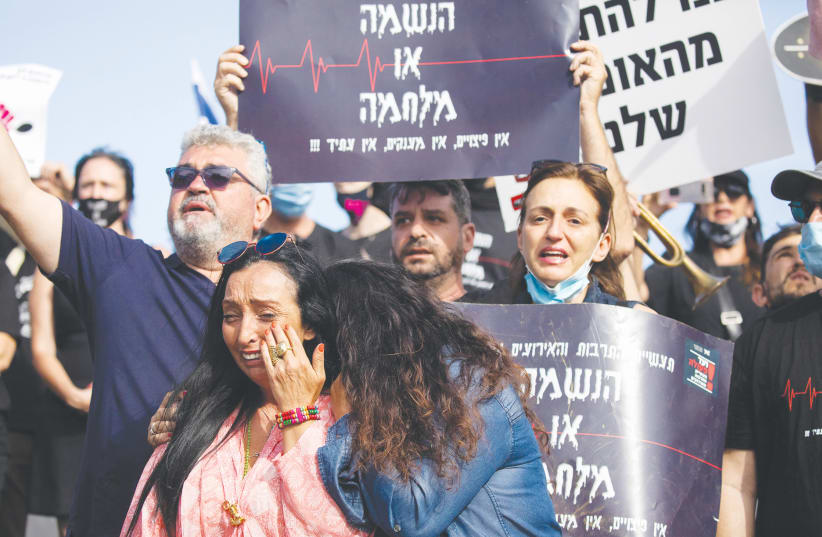 Workers protest outside the Finance Ministry in Jerusalem, June 2020 (photo credit: YONATAN SINDEL/FLASH90)