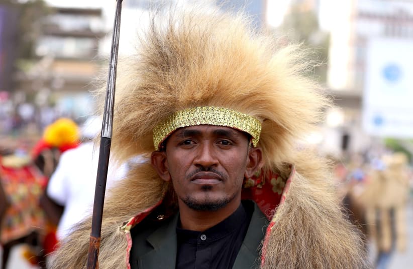 Ethiopian musician Haacaaluu Hundeessaa poses dressed in traditional costumes during the 123rd anniversary celebration of the battle of Adwa where the Ethiopian forces defeated an invading Italian forces, in Addis Ababa (photo credit: REUTERS)