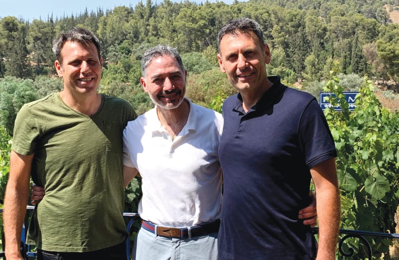 MARTIN SINKOFF flanked by the Flam brothers, Gilad and Golan, at their beautiful eponymous winery (photo credit: COURTESY MARTIN SINKOFF)