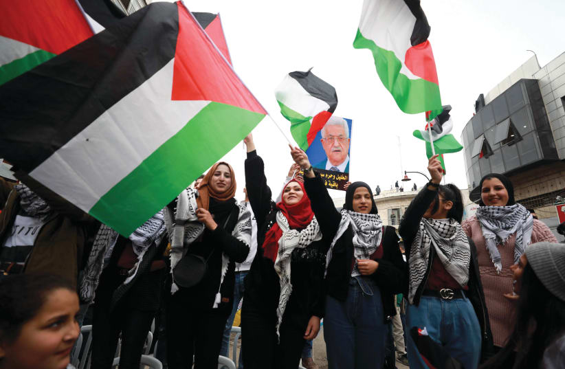 Flags at a February rally in Ramallah in support of PA President Mahmoud Abbas and against Trump’s peace plan (photo credit: FLASH90)