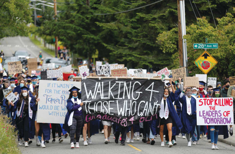 STUDENTS RALLY against racial inequality in Seattle, June 2020 (photo credit: REUTERS/LINDSEY WASSON)
