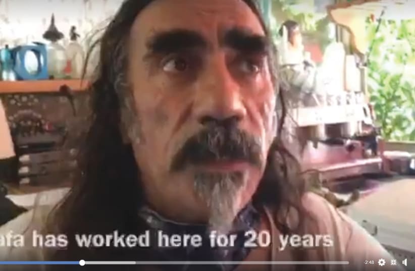 A STILL from the video currently circulating on social media in which Kalo owner Yaacov ben Elul discusses cook Mustafa Hawl’s years of tenure at the café (photo credit: screenshot)