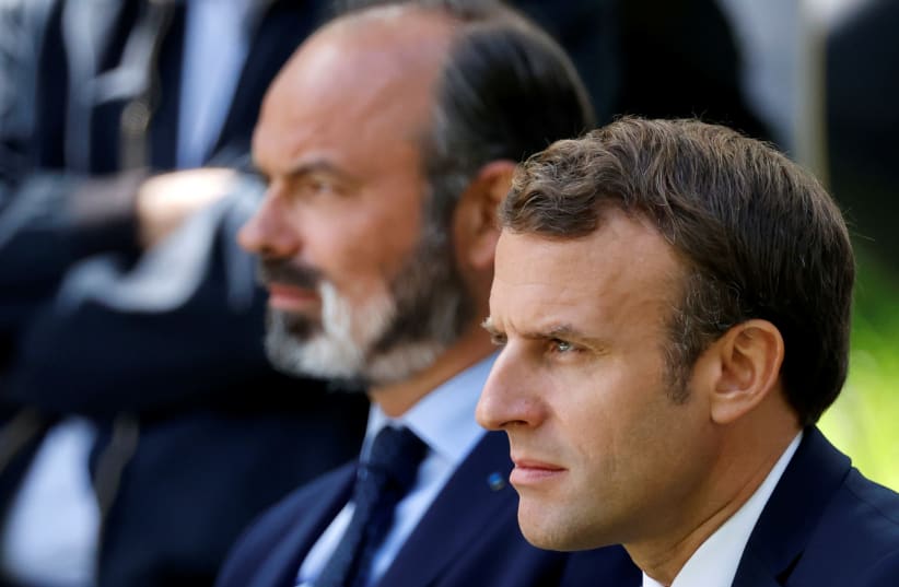 French President Emmanuel Macron and French Prime Minister Edouard Philippe attend a meeting with members of the Citizens' Convention on Climate (CCC) to discuss over environment proposals at the Elysee Palace in Paris, France June 29, 2020 (photo credit: REUTERS/CHRISTIAN HARTMANN)