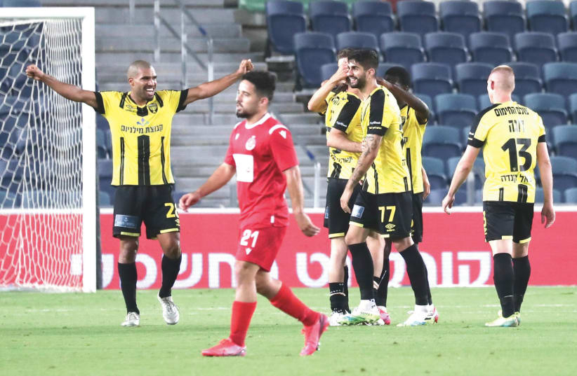 BEITAR JERUSALEM celebrates after earning a 3-1 victory over Hapoel Tel Aviv on Saturday night at Teddy Stadium. It was the yellow-and-black’s first conquest of the Championship Playoffs and it clinched a spot in Europa League qualifying.  (photo credit: DANNY MARON)