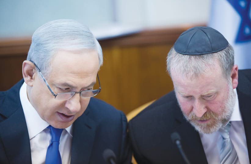 PRIME MINISTER Benjamin Netanyahu and Attorney-General Avichai Mandelblit talk at the Prime Minister’s Office in Jerusalem in 2015. (photo credit: YONATAN SINDEL/FLASH 90)