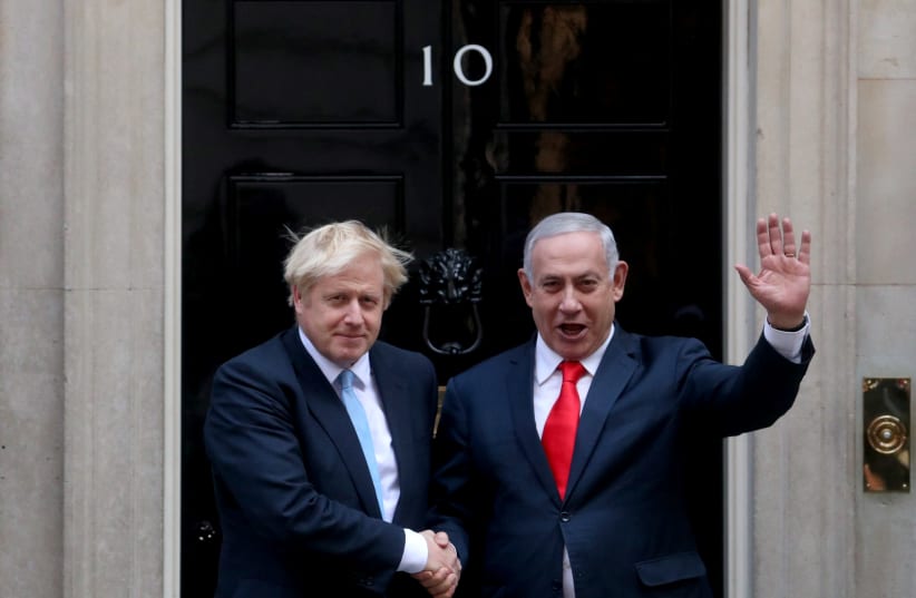 Britain's Prime Minister Boris Johnson welcomes Israel's Prime Minister Benjamin Netanyahu outside Downing Street in London, Britain September 5, 2019 (photo credit: REUTERS/HANNAH MCKAY)