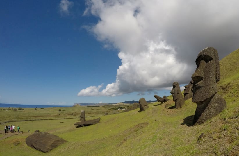Statues named moai are seen on a hill at the Easter Island, Chile February 1, 2019. (photo credit: JORGE VEGA/REUTERS)